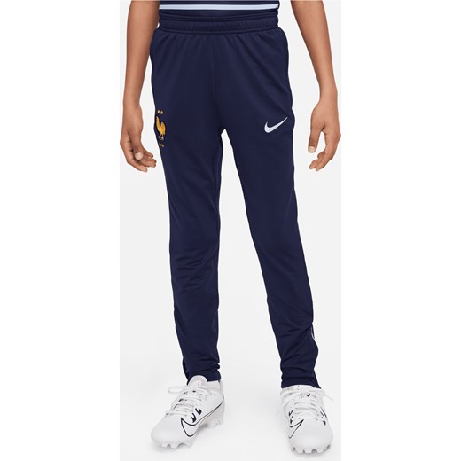 Dzianinowe spodnie piłkarskie dla dużych dzieci Nike Dri-FIT FFF Strike - Niebieski ze sklepu Nike poland w kategorii Spodnie chłopięce - zdjęcie 171206749