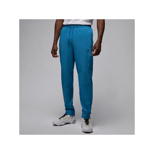 Męskie spodnie z tkaniny Dri-FIT Jordan Sport - Niebieski ze sklepu Nike poland w kategorii Spodnie męskie - zdjęcie 171247909