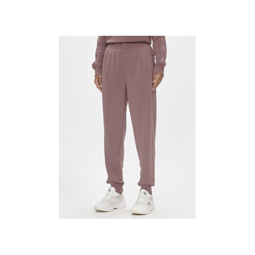 Calvin Klein Performance Spodnie dresowe 00GWS4P656 Różowy Relaxed Fit ze sklepu MODIVO w kategorii Spodnie damskie - zdjęcie 171254785