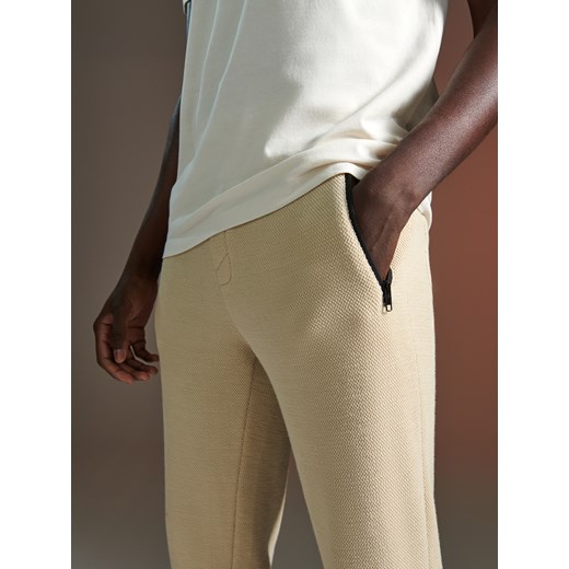 Sinsay - Spodnie dresowe - kremowy Sinsay XS Sinsay