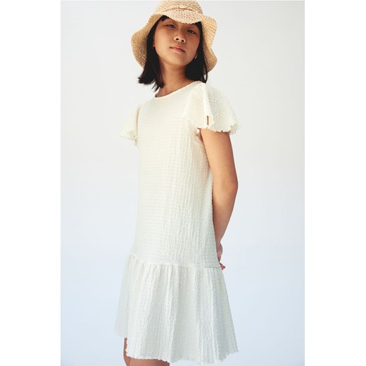 H & M - Dżersejowa sukienka z falbankowym rękawem - Biały H & M 134 H&M