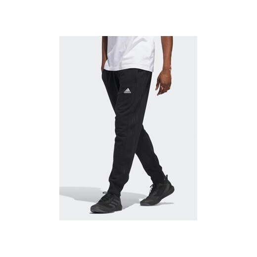 adidas Spodnie dresowe Essentials HZ2218 Czarny Regular Fit ze sklepu MODIVO w kategorii Spodnie męskie - zdjęcie 171342029