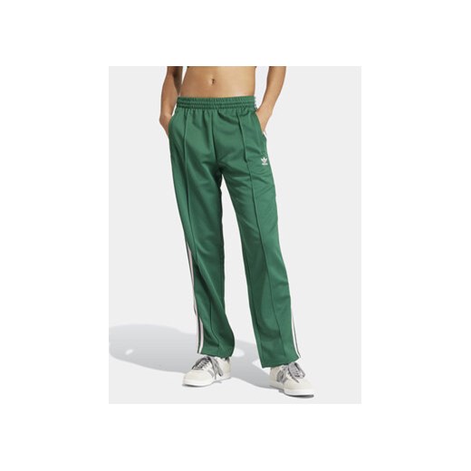 adidas Spodnie dresowe adicolor Classics SST IM9818 Zielony Loose Fit ze sklepu MODIVO w kategorii Spodnie damskie - zdjęcie 171343827