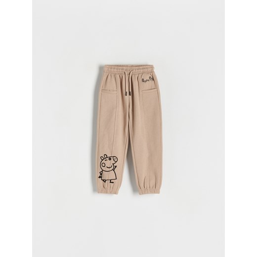 Reserved - Spodnie dresowe Świnka Peppa - beżowy ze sklepu Reserved w kategorii Spodnie i półśpiochy - zdjęcie 171475987