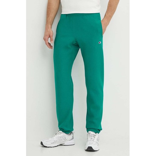 Champion spodnie męskie kolor zielony z aplikacją 216540 ze sklepu PRM w kategorii Spodnie męskie - zdjęcie 171559786