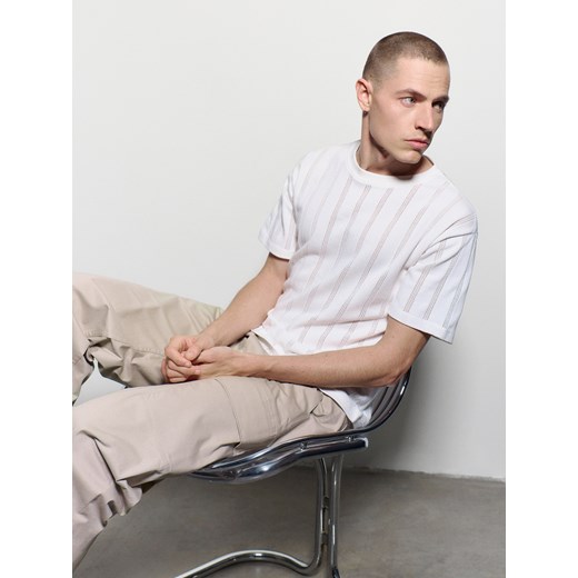 Spodnie męskie beżowe Reserved casual na jesień 