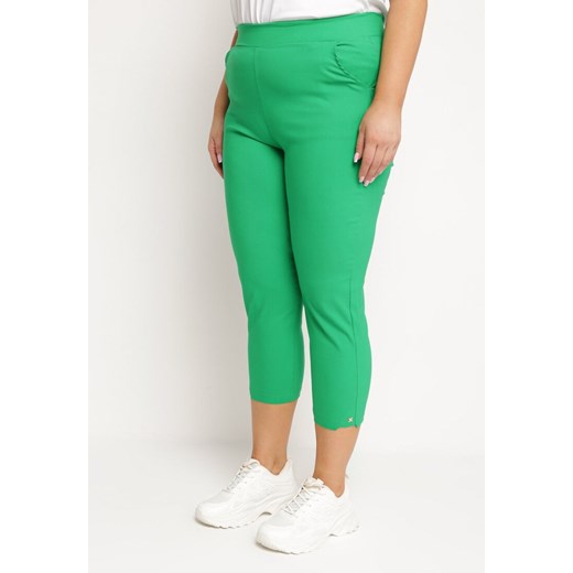 Zielone Bawełniane Spodnie z Gumką w Pasie 7/8 z Małą Ozdobą przy Nogawce Moanina ze sklepu Born2be Odzież w kategorii Spodnie damskie - zdjęcie 172198998