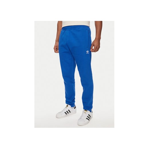 adidas Spodnie dresowe Trefoil Essentials IR7806 Niebieski Regular Fit ze sklepu MODIVO w kategorii Spodnie męskie - zdjęcie 172288505