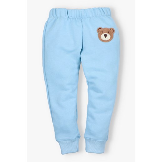 Spodnie dresowe z misiem - niebieskie - Pretilo ze sklepu 5.10.15 w kategorii Spodnie chłopięce - zdjęcie 172338615