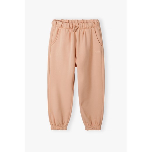 Spodnie dresowe z kieszeniami - brzoskwiniowe  - Limited Edition ze sklepu 5.10.15 w kategorii Spodnie dziewczęce - zdjęcie 172354419