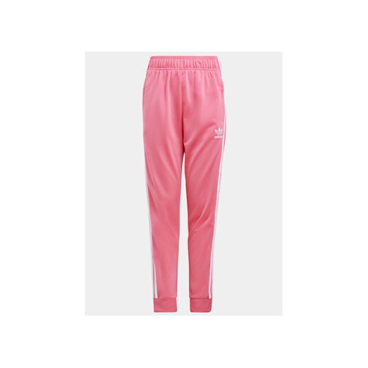 adidas Spodnie dresowe adicolor SST IN8492 Różowy Regular Fit ze sklepu MODIVO w kategorii Spodnie dziewczęce - zdjęcie 172370477