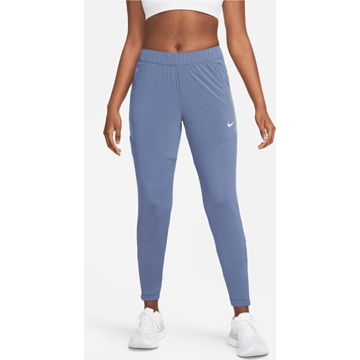 Damskie spodnie do biegania Nike Dri-FIT Essential - Niebieski ze sklepu Nike poland w kategorii Spodnie damskie - zdjęcie 172393306
