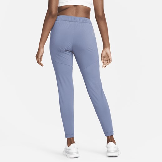 Damskie spodnie do biegania Nike Dri-FIT Essential - Niebieski Nike XL (EU 48-50) Nike poland