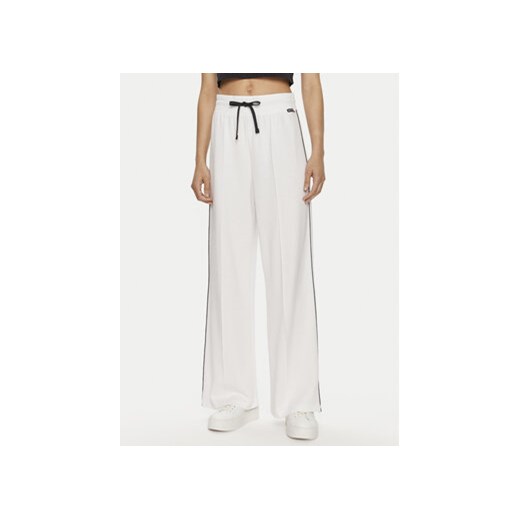 Tommy Hilfiger Spodnie dresowe UW0UW05237 Biały Relaxed Fit ze sklepu MODIVO w kategorii Spodnie damskie - zdjęcie 172400526