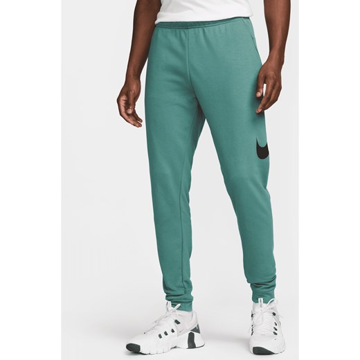 Męskie zwężane spodnie do fitnessu Dri-FIT Nike Dry Graphic - Zieleń Nike XXL Nike poland