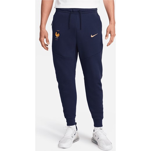 Męskie joggery piłkarskie Nike FFF Tech Fleece - Niebieski ze sklepu Nike poland w kategorii Spodnie męskie - zdjęcie 172407288