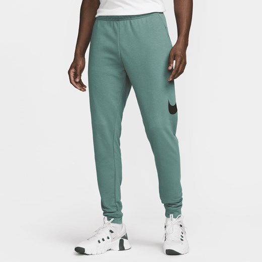 Męskie zwężane spodnie do fitnessu Dri-FIT Nike Dry Graphic - Zieleń Nike XL Nike poland