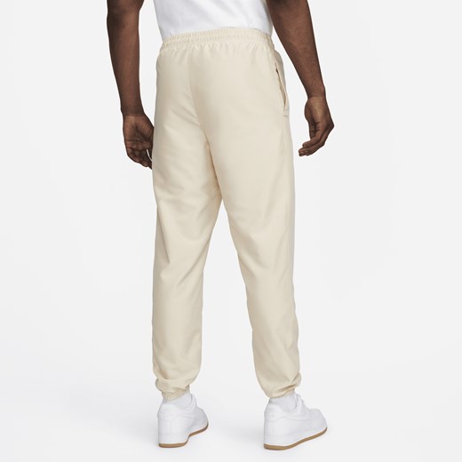 Męskie spodnie z tkaniny Nike Sportswear - Brązowy Nike S Nike poland