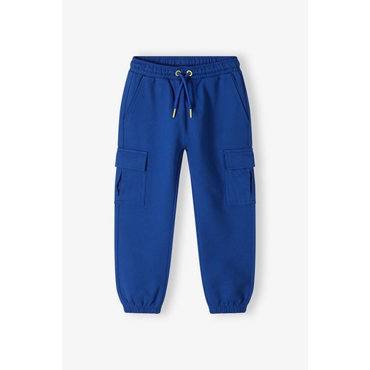 Dresowe spodnie bojówki dla chłopca - niebieskie - 5.10.15. ze sklepu 5.10.15 w kategorii Spodnie chłopięce - zdjęcie 172420176
