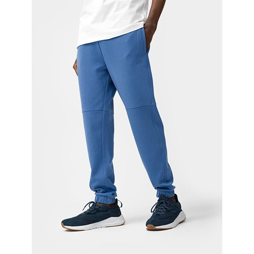 4F Spodnie dresowe w kolorze niebieskim ze sklepu Limango Polska w kategorii Spodnie męskie - zdjęcie 172537445