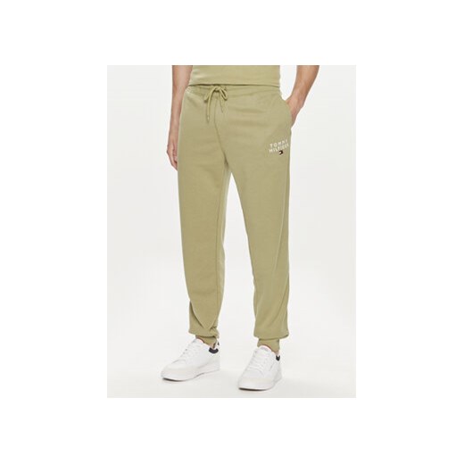 Tommy Hilfiger Spodnie dresowe UM0UM02880 Zielony Regular Fit ze sklepu MODIVO w kategorii Spodnie męskie - zdjęcie 172598407