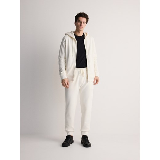 Reserved - Bawełniane spodnie dresowe - złamana biel ze sklepu Reserved w kategorii Spodnie męskie - zdjęcie 172599848