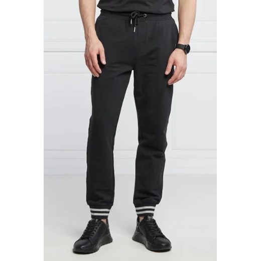 GUESS Spodnie dresowe Adam | Relaxed fit ze sklepu Gomez Fashion Store w kategorii Spodnie męskie - zdjęcie 172981457