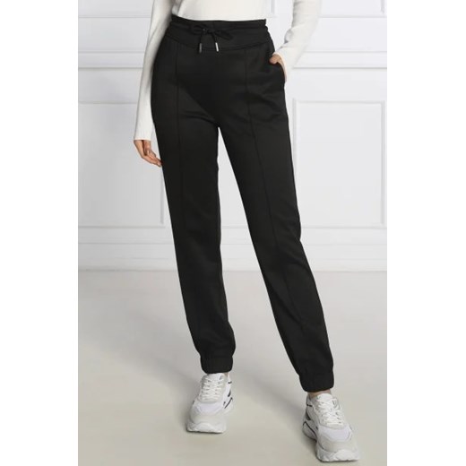GUESS Spodnie dresowe ARMELLE | Regular Fit ze sklepu Gomez Fashion Store w kategorii Spodnie damskie - zdjęcie 172987147