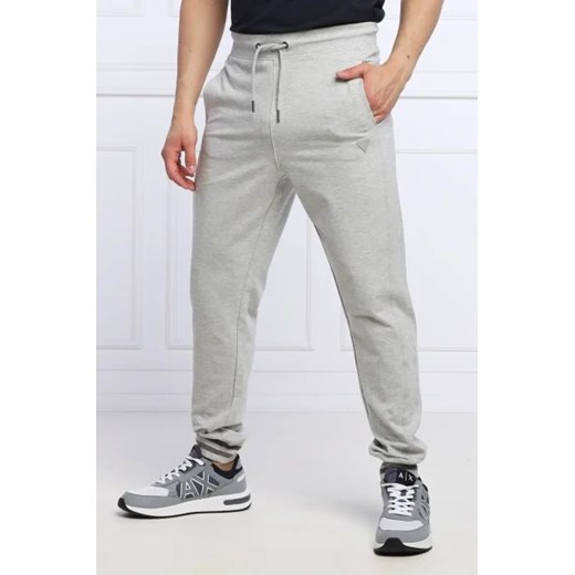 GUESS Spodnie dresowe Adam | Relaxed fit ze sklepu Gomez Fashion Store w kategorii Spodnie męskie - zdjęcie 172988549