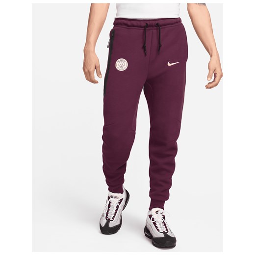 Męskie joggery piłkarskie Nike Paris Saint-Germain Tech Fleece - Czerwony ze sklepu Nike poland w kategorii Spodnie męskie - zdjęcie 173311225