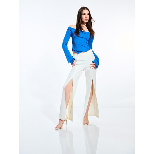 Mohito - Spodnie z rozcięciami - biały ze sklepu Mohito w kategorii Spodnie damskie - zdjęcie 173518298