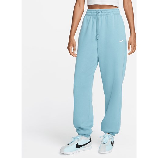 Damskie spodnie dresowe o kroju oversize z wysokim stanem Nike Sportswear Phoenix Fleece - Niebieski ze sklepu Nike poland w kategorii Spodnie damskie - zdjęcie 174000846
