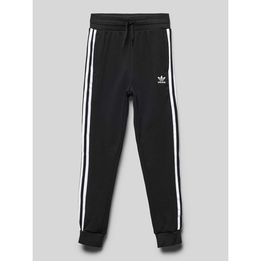 Spodnie dresowe o kroju regular fit z wyhaftowanym logo model ‘TREFOIL’ ze sklepu Peek&Cloppenburg  w kategorii Spodnie chłopięce - zdjęcie 174113329