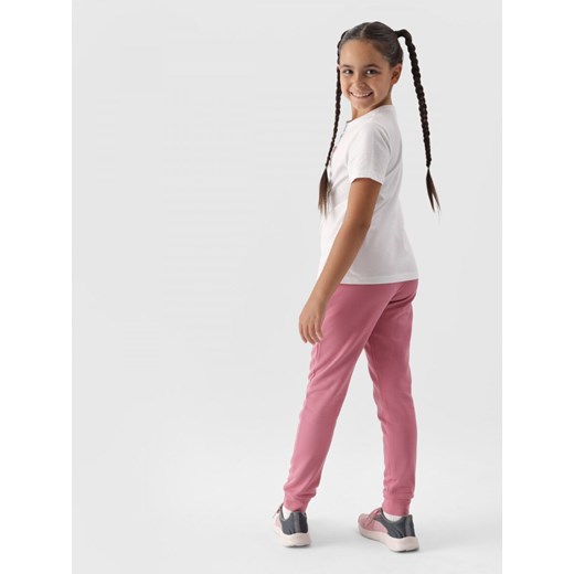Dziewczęce spodnie dresowe joggery 4F 4FJWMM00TTROF0828 - różowe ze sklepu Sportstylestory.com w kategorii Spodnie dziewczęce - zdjęcie 174652387