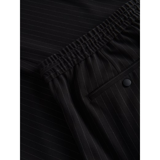 Spodnie męskie Reserved z elastanu