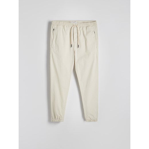 Reserved - Spodnie jogger slim - złamana biel Reserved L Reserved
