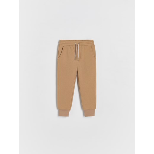 Reserved - Dresowe spodnie - brązowy Reserved 98 (2-3 lata) Reserved
