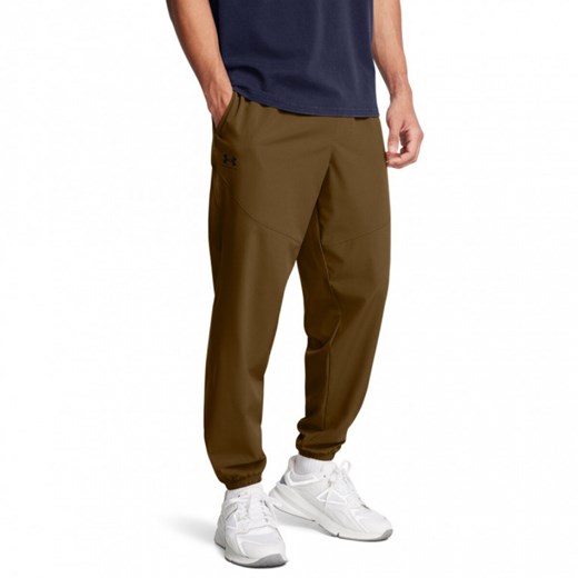 Męskie spodnie treningowe Under Armour UA Vibe Woven Pants - brązowe ze sklepu Sportstylestory.com w kategorii Spodnie męskie - zdjęcie 174963425