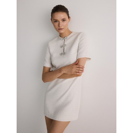 Reserved - Sukienka z ozdobnymi kokardami - złamana biel Reserved M Reserved