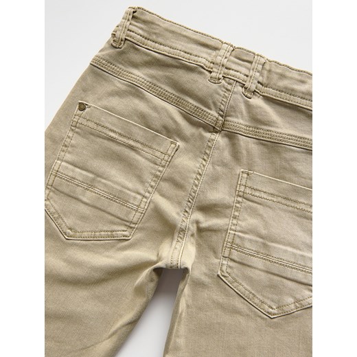Reserved - Elastyczne spodnie slim - beżowy Reserved 134 (8 lat) Reserved