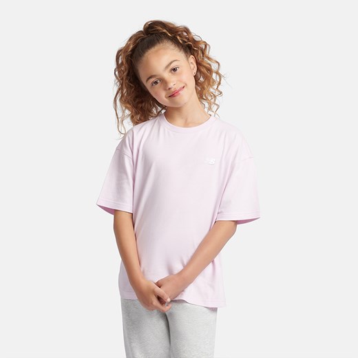Koszulka dziecięca New Balance LAKG0001LIR – różowa ze sklepu New Balance Poland w kategorii Bluzki dziewczęce - zdjęcie 175284517
