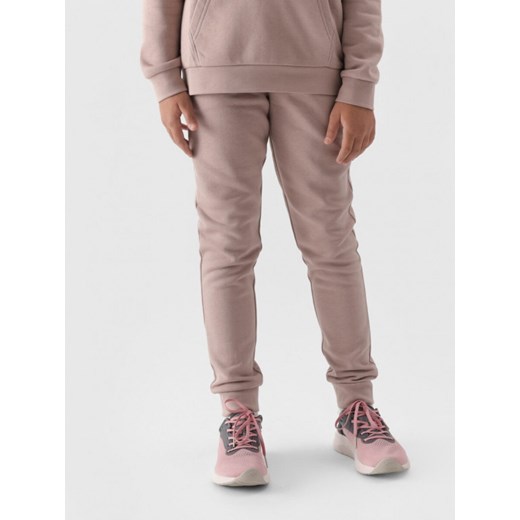Dziewczęce spodnie dresowe joggery 4F 4FJWMM00TTROF0828 - beżowe ze sklepu Sportstylestory.com w kategorii Spodnie dziewczęce - zdjęcie 175409985