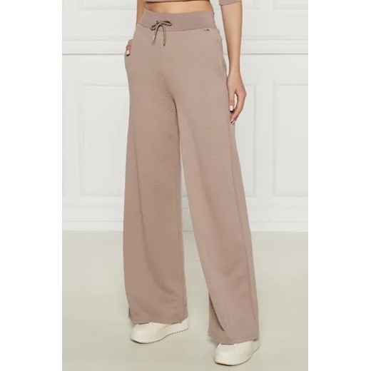 GUESS ACTIVE Spodnie dresowe PEONY | Relaxed fit ze sklepu Gomez Fashion Store w kategorii Spodnie damskie - zdjęcie 175427329