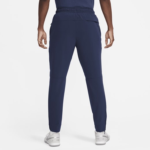 Męskie uniwersalne spodnie ze ściągaczami i zamkami Dri-FIT Nike Unlimited - Nike XXL Nike poland