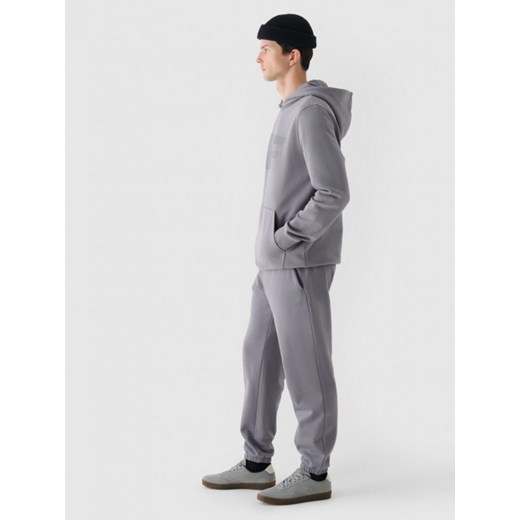 Męskie spodnie dresowe joggery 4F 4FWMM00TTROM1140 - szare ze sklepu Sportstylestory.com w kategorii Spodnie męskie - zdjęcie 175556816