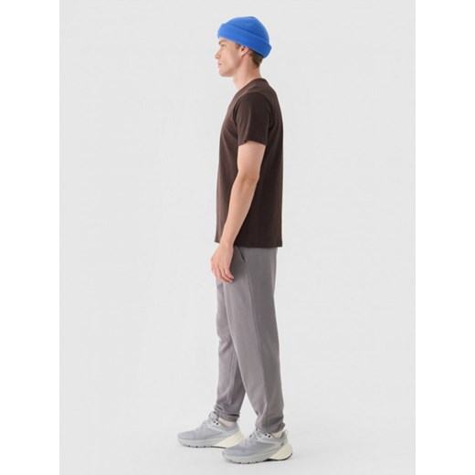 Męskie spodnie dresowe joggery 4F 4FWMM00TTROM1139 - szare ze sklepu Sportstylestory.com w kategorii Spodnie męskie - zdjęcie 175556839