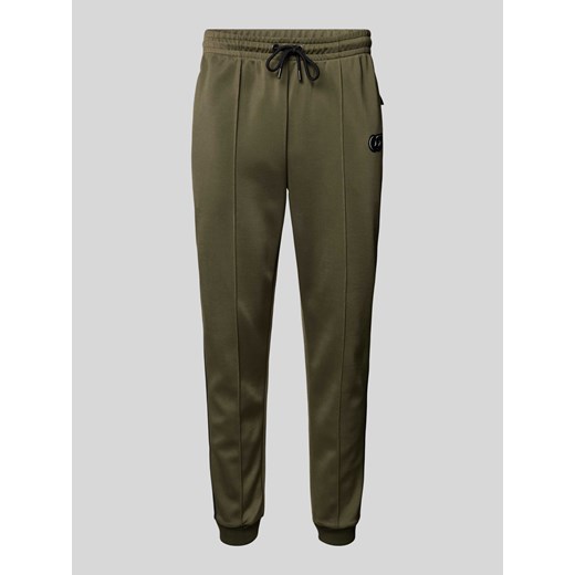 Spodnie dresowe o kroju regular fit z przeszytym kantem model ‘PERAN’ ze sklepu Peek&Cloppenburg  w kategorii Spodnie męskie - zdjęcie 175816749