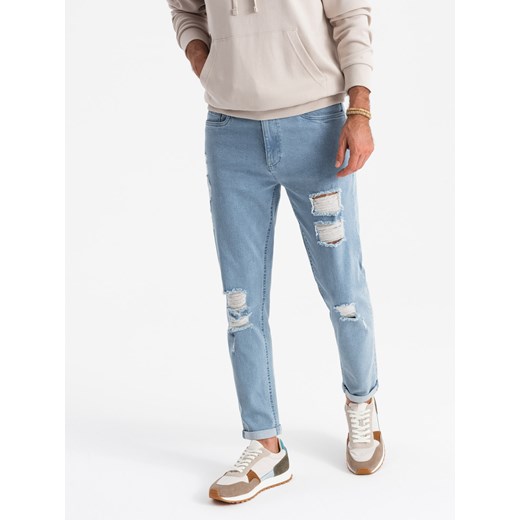 Washowane męskie jeansowe spodnie TAPERED FIT z przetarciami – błękitne V1 OM-PADP-0163 ze sklepu ombre w kategorii Jeansy męskie - zdjęcie 176237665