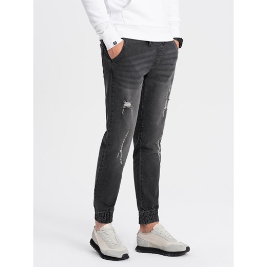 Męskie spodnie jeansowe JOGGERY z przetarciami - czarne V2 OM-PADJ-0150 ze sklepu ombre w kategorii Jeansy męskie - zdjęcie 176289135