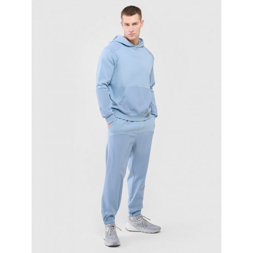 Męska bluza dresowa nierozpinana z kapturem Outhorn OTHWAW24TSWSM1917 - niebieska ze sklepu Sportstylestory.com w kategorii Bluzy męskie - zdjęcie 176554897